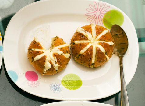 round baked bread with butter inside