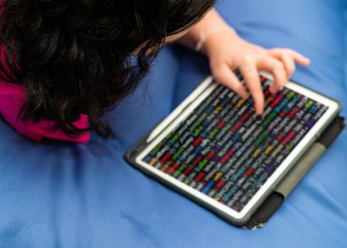 kid use tablet phone to coding