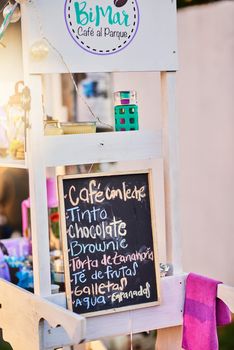 Shot of a baked goods stall with a variety of goods to choose from and written down on a chalk board.