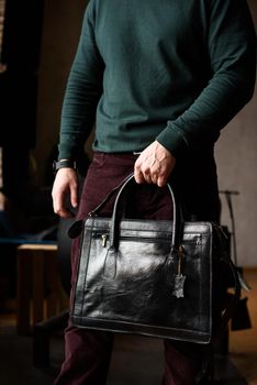 close-up photo of black leather bag corporate. indoor photo