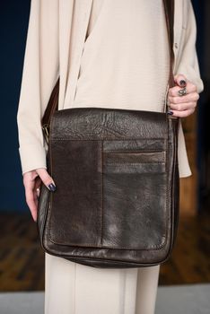 close-up photo of brown leather bag . indoor photo