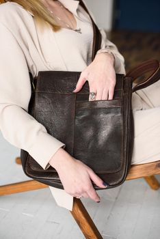 close-up photo of brown leather bag . indoor photo