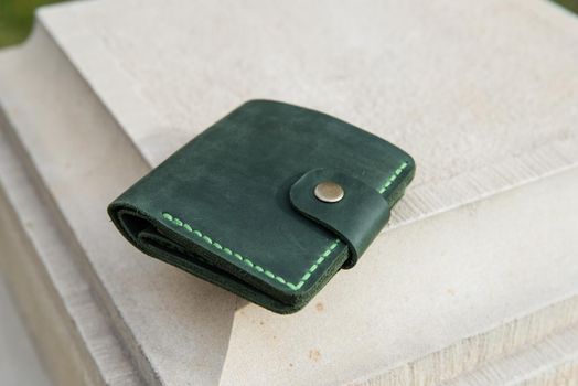 hand made leather wallet . Leather craft. Selective focus.