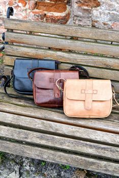 Set of hand made leather handbags . Multi colored. Leather craft. Selective focus.