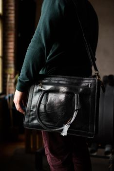 close-up photo of black leather bag corporate. indoor photo