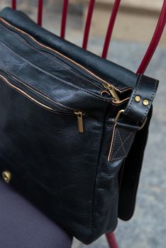 close-up photo of black leather bag corporate. street photo