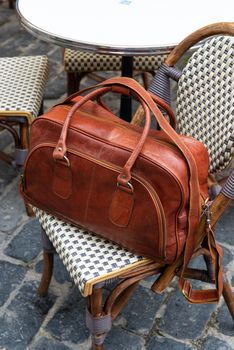 close-up photo of brown leather bag corporate. street photo