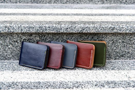 Set of hand made leather man wallet . Multi colored. Leather craft. Selective focus.