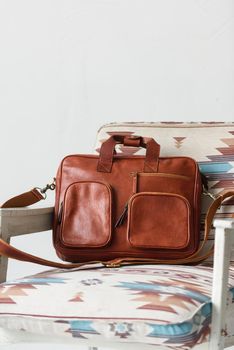close-up photo of red leather bag corporate. Indoor photo