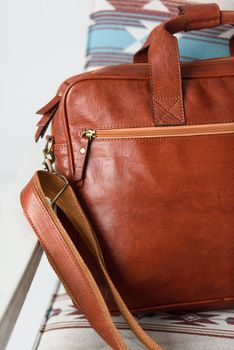 close-up photo of red leather bag corporate. Indoor photo