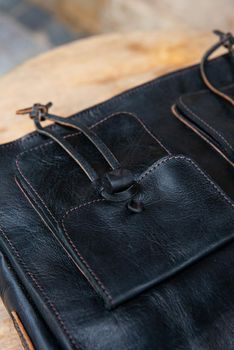 close-up photo of black leather bag corporate. street photo