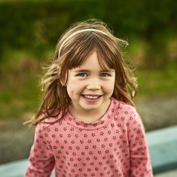 Portrait of an adorable little girl having fun outdoors.