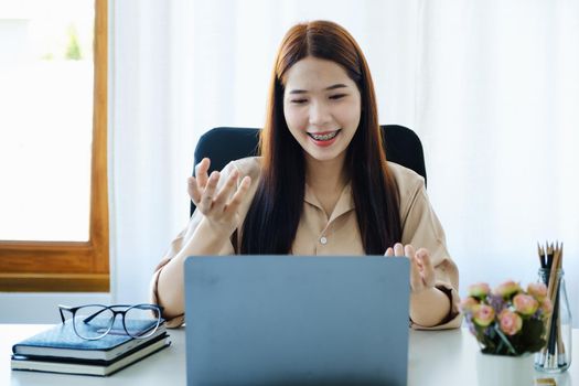 Conversation, online teaching, explaining, meeting, asian teachers are teaching books using computers to teach students online lessons in the era of corona virus