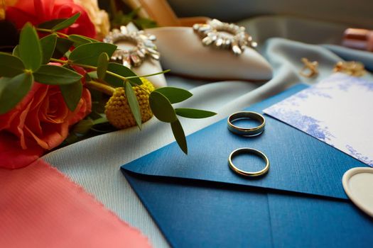 Wedding rings and wedding invitation. Shallow dof.