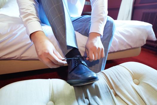 Business man or groom dressing up with classic elegant shoes. Shallow dof