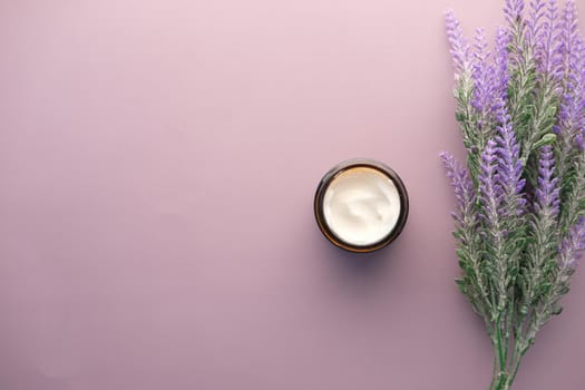 herbal cream cosmetic in a container on table