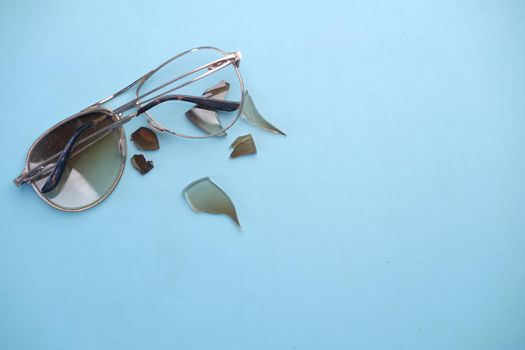 broken eye glass on table with copy space .