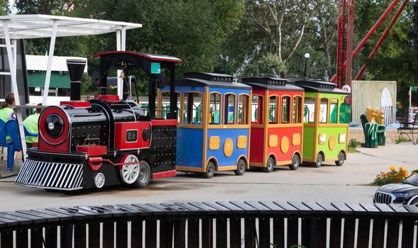 A train with trailers for children, on the playground.