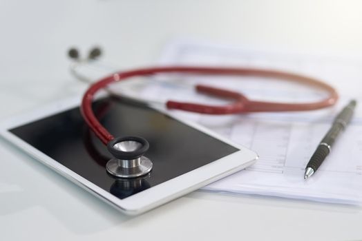 Cropped shot of a stethoscope on a tablet.