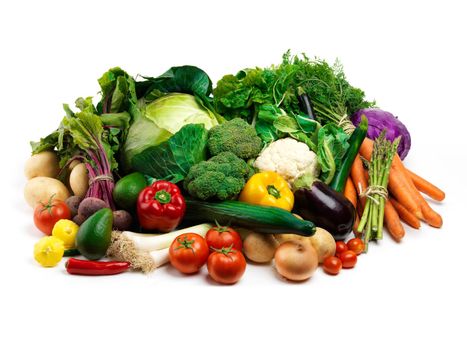 Studio shot of a pile of fruit and vegetables against a white background.