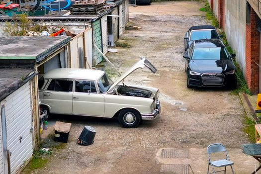 London, United Kingdom, February 4, 2022: View of an old beautiful car near garages in London