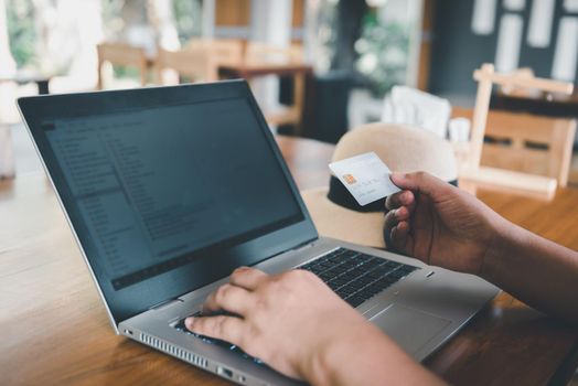 Business Credit Banking and Online Shopping Service, Close-Up of Business Woman Hands Using Credit Card for Paying Online Shopping on E-Commerce Web in Coffee Shop. Shopping Payment Via Credit Card