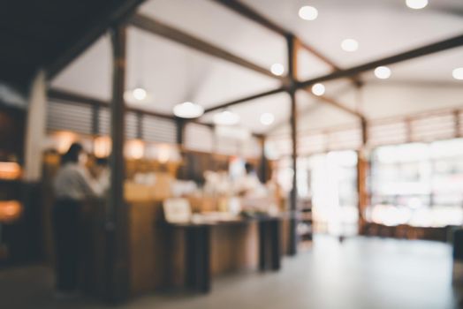 Coffee Cafe Shop Background, Abstract Defocused Blur of Interior Coffee Shop and Restaurant. Coffee Interiors Bar Space for Customer Relax. Blurry Bokeh Light Bulb in Cafe Store