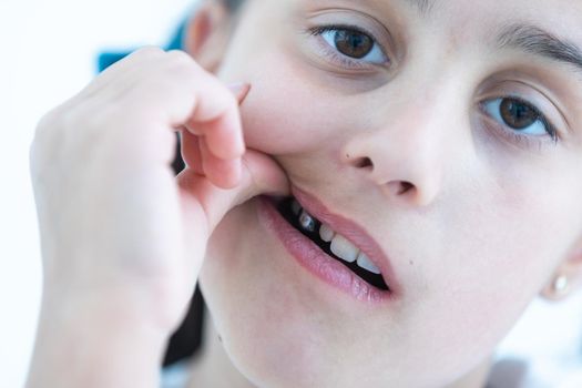 little girl showing her healthy teeth at dental office, smiling and waiting for a checkup. Early prevention, paedodontics and no fear concept