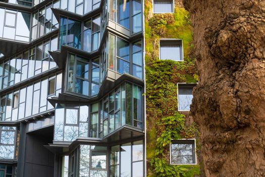 Rennes, France - march 21 2022:  Urban facade, vertical green garden in architecture. Ecological building in Rennes, France