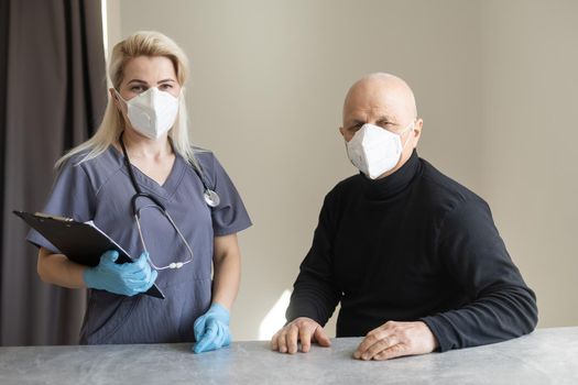 Young nurse taking care of old sick man.