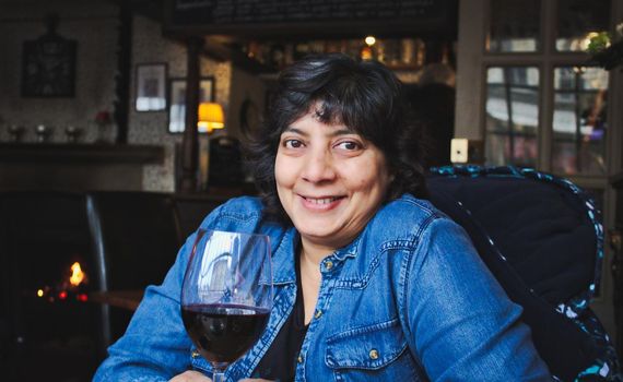 Woman drinking red wine in a gastro-pub bar / restaurant