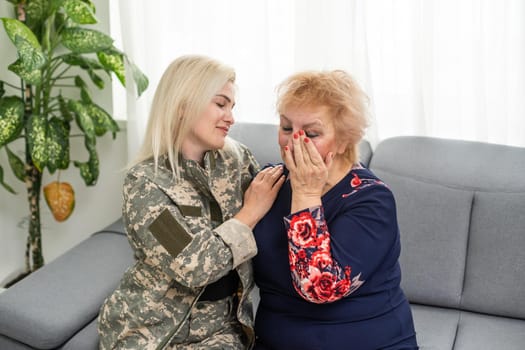 Soldier woman reunited with her mother.
