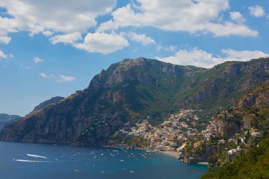 One of the best resorts of Italy with old colorful villas on the steep slope, nice beach, numerous yachts and boats in harbor and medieval towers along the coast, Positano