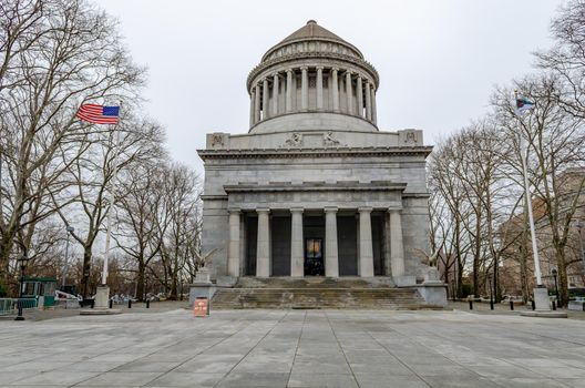General Grant National Memorial at Riverside Park during winter day with overcast, Harlem, New York City, No People, American Flag next to it, during winter day with overcast, trees around the building, horizontal