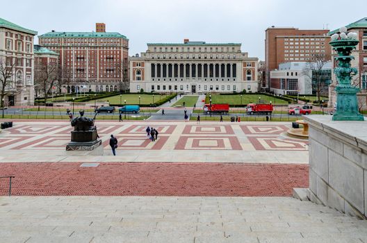 Aerial view of the Columbia University, view from the Library of Columbia University, Staircase in the forefront, Park with meadow and Students in the background, New York City, during winter day with overcast, horizontal