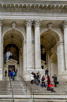 Entrance of New York Public Library with staircase, People entering and leaving the Building, United States, close-up, vertical
