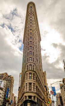 Flatiron Building New York City, low angle view during sunset and overcast, vertical