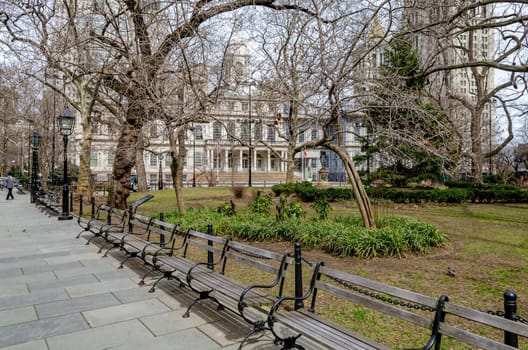 New York City Hall with trees, Public Park and benches in a row in forefront during Winter, during winter, horizontal