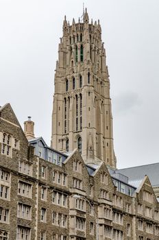 Riverside Church Tower during winter day with overcast, Building facades in the forefront, Harlem, New York City, vertical