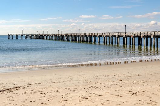 Pat Auletta Steeplechase Pier at Coney island Beach, view from the side, Brooklyn, New York City during winter day with almost clear sky, Ocean in the Background, horizontal