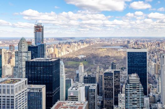 Central Park New York City wit lots of skyscraper around and hudson river, aerial view from Rockefeller Center during winter, horizontal