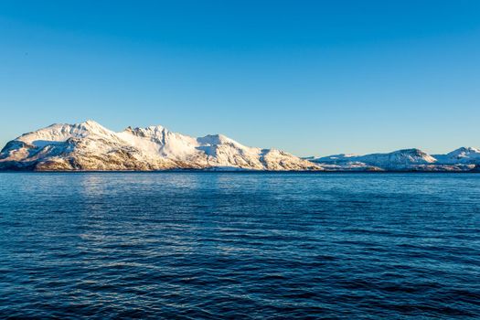 Norwegian Snow Mountains with Fjord close to Tromso