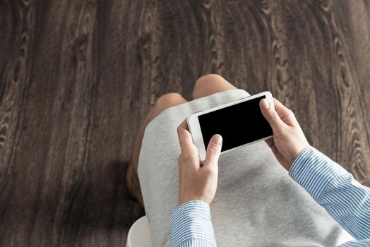 close-up of female hands with a phone