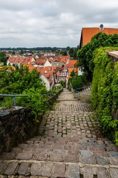 Old stairs in Zwingenberg Cityscape with roofs of old town during a cloudy day