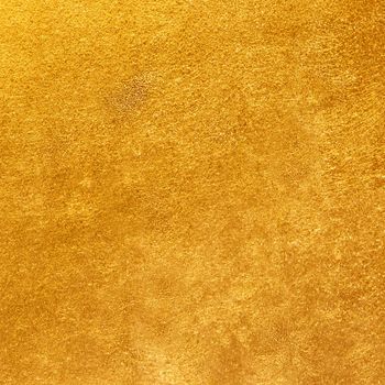 Background of a rough surface of golden color close-up