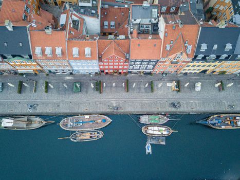 Copenhagen, Denmark - April 07, 2020: Aerial drone view of the famous Nyhavn district in the historic city centre.