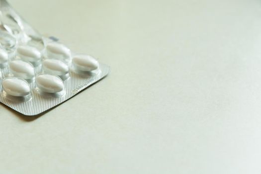 White pills blister pack, place for text, close up
