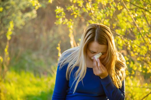 The girl is allergic to flowers in the field.