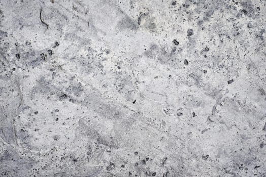 Gray concrete wall as background. Stone texture close up