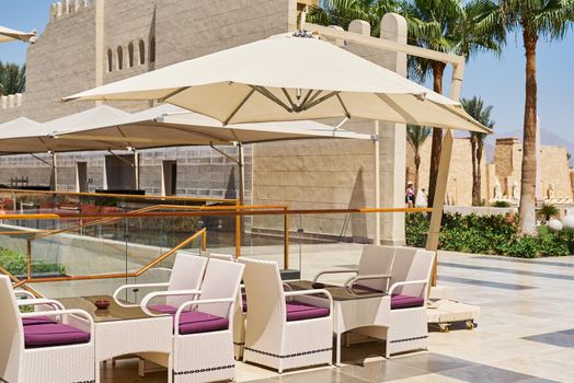 Empty terrace with table and chairs outdoor in summer day